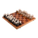 Y A RUSSIAN WOOLLY MAMMOTH IVORY 'ANIMALIER' CHESS SETLATE 20TH CENTURY