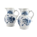 A PAIR OF WORCESTER BLUE AND WHITE PRINTED CABBAGE-LEAF MOULDED MASK JUGS, CIRCA 1780