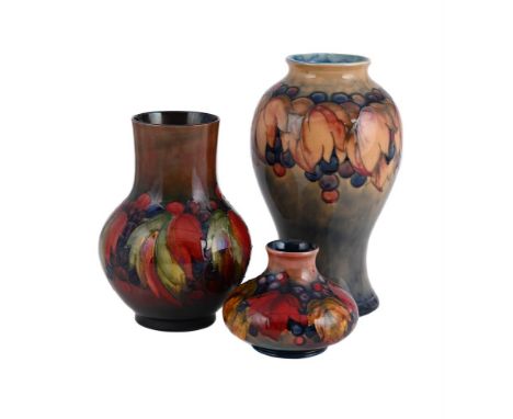 THREE 'LEAF AND BERRY' MOORCROFT VASES CIRCA 1930 All with painted and impressed marks the tallest vase 32cm high  Condition 