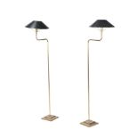 A PAIR OF BRASS FLOOR STANDING READING LAMPS