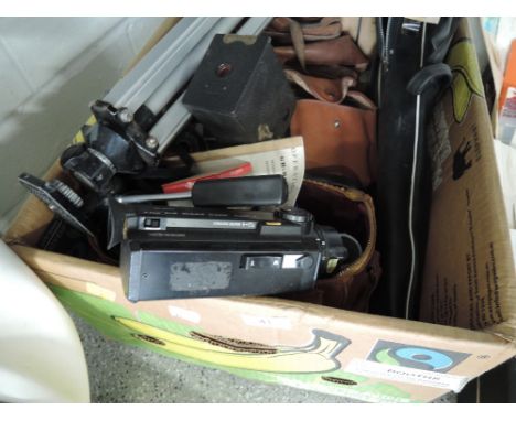 A selection of camera and film equipment, including Brownie model one, Olympus