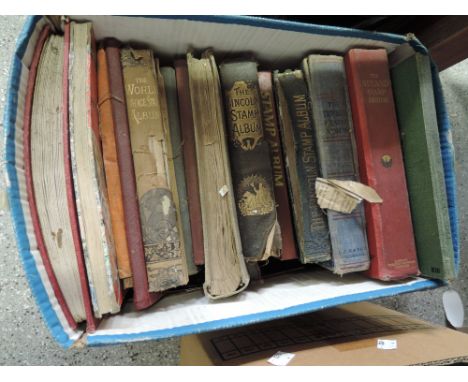 A box of vintage stamp albums