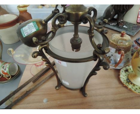 A vintage light fitting, coal tongs and glass bowl