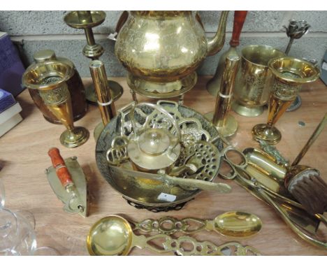 A selection of brassware including kettle, tea caddy, trivet, bell, candlesticks etc