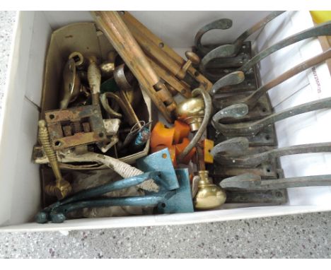 A box of vintage door furniture and coat hooks etc