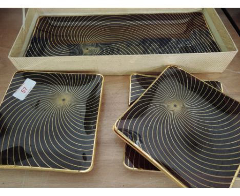 A boxed set of Ruby glass and gilt plates