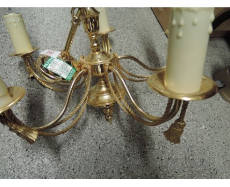 A five candle brass effect light fitting