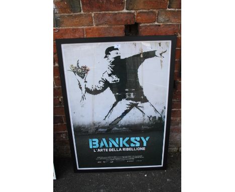 A LARGE FRAMED AND GLAZED BANKSY L'ARTE DELLA RIBELLIONE PRINT OVERALL SIZE INCLUDING FRAME - 105CM X 75CM 