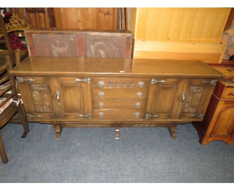 A CARVED OAK ERCOL STYLE SIDEBOARD H-80 W-186 CM