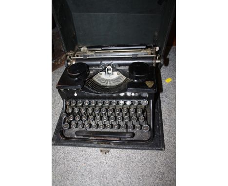 A VINTAGE CASED THRALE &amp; BEAUMONT PORTABLE TYPEWRITER