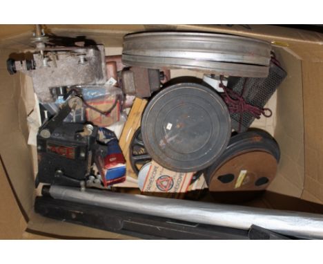 A COLLECTION OF FILM REEL EQUIPMENT TO INCLUDE A BELL &amp; HOWELL PROJECTOR, FILM REELS ETC