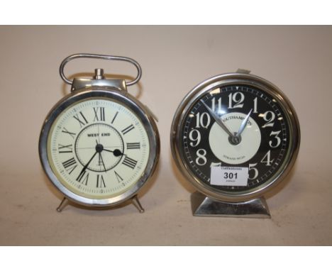 A MODERN WEST END ALARM CLOCK TOGETHER WITH A MODERN MANTEL CLOCK