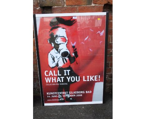 A LARGE FRAMED AND GLAZED BANKSY 'CALL IT WHAT YOU LIKE' COLLECTION RIK REINKING PRINT OVERALL SIZE INCLUDING FRAME - 74.5CM 