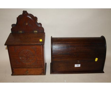 A VINTAGE CARVED OAK CANDLE BOX TOGETHER WITH A MAHOGANY TAMBOUR FRONTED LETTER RACK