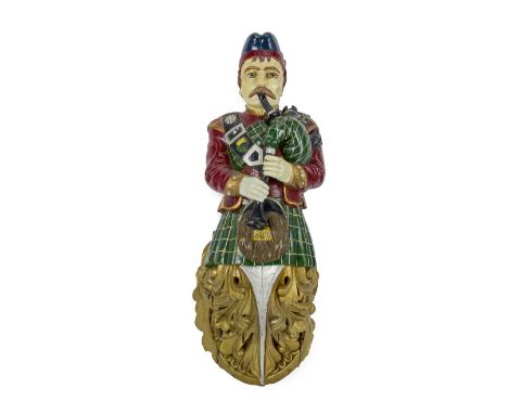 An English carved and painted jointing figure of a Scottish bagpipe playerAttributed to Orton & Spooner, circa 1900Originally