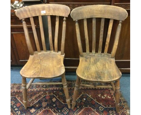 Two antique stick back chairs.