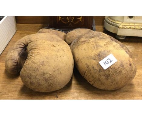 A pair of vintage boxing gloves.