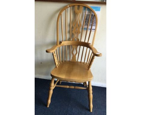 A stick back Windsor chair.