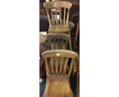 A set of four stick back chairs.