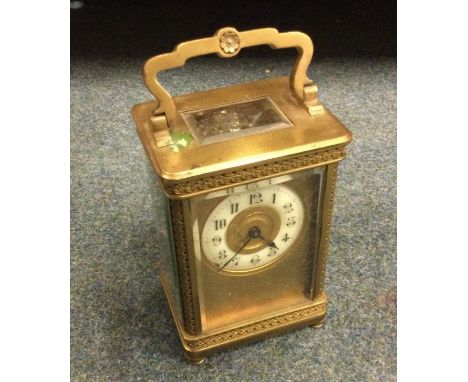 A brass mounted carriage clock.