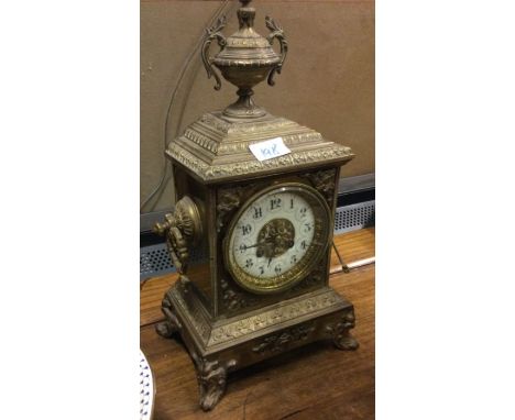A brass mounted mantle clock.