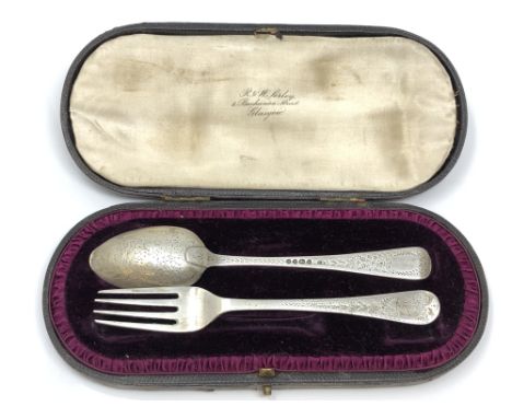 A boxed silver fork and spoon, London 1887