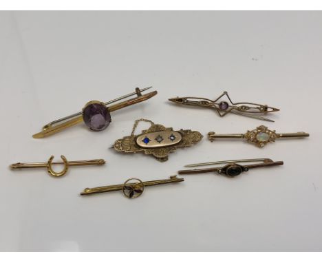 A group of seven gold brooches set with opal, amethyst, seed pearls, tourmaline etc CONDITION REPORT: 16.8g gross