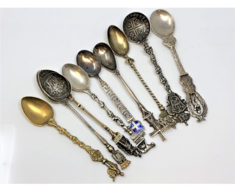 Nine highly ornate silver gilt and enamel spoons, including Napoleon.