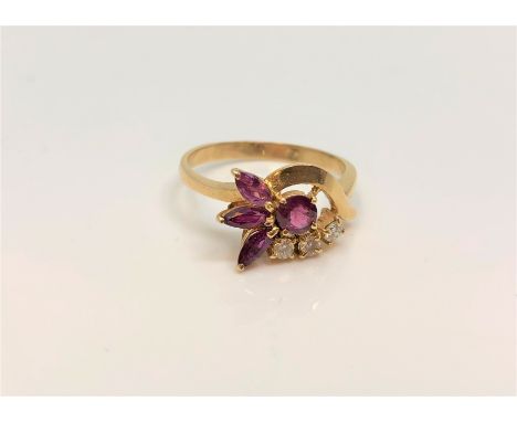 An 18ct gold ruby and diamond ring, size P/Q.