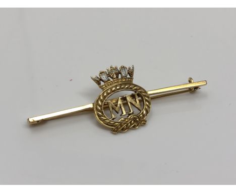 A gold and enamel Merchant Navy brooch