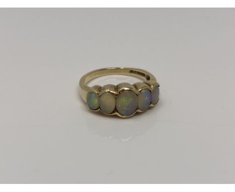 A 9ct gold five stone opal ring, size N CONDITION REPORT: 3.4g