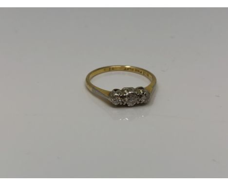 An 18ct gold three stone diamond ring, size O CONDITION REPORT: 2.3g