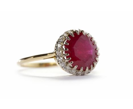 RUBY AND DIAMOND CLUSTER RINGthe round ruby 11mm in diameter, surrounded by round brilliant cut diamonds, in eighteen carat g