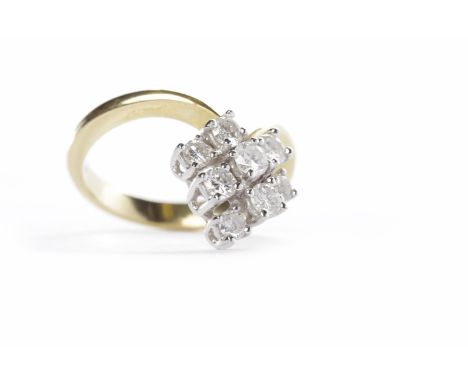DIAMOND WISHBONE RINGen suite to the previous lot, with a cluster of round brilliant cut diamonds totalling approximately 0.6