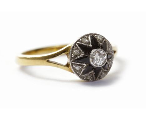 ART DECO DIAMOND AND SAPPHIRE RINGthe round bezel 9mm diameter and set with a central round diamond of approximately 0.13 car