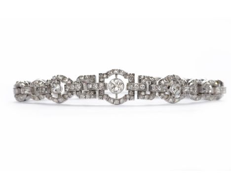 IMPRESSIVE ART DECO DIAMOND SET BRACELETof tapered articulated form and formed by alternating geometic sections pave set with