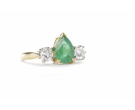 EMERALD AND DIAMOND THREE STONE RINGthe central pear shaped emerald approximately 7.8x5.8mm and flanked by two round brillian