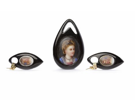 VICTORIAN JET PENDANTof pear shaped form, with central oval printed portrait of a girl, 63mm high; along with a pair of Victo