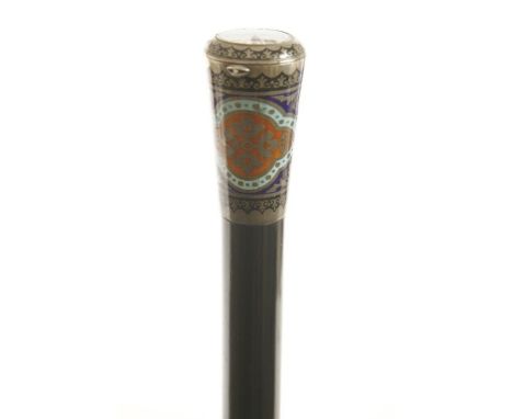 An unusual watch cane,c,1890, possibly manufactured in Russia, with a French clock decorated with an enamel surround below th
