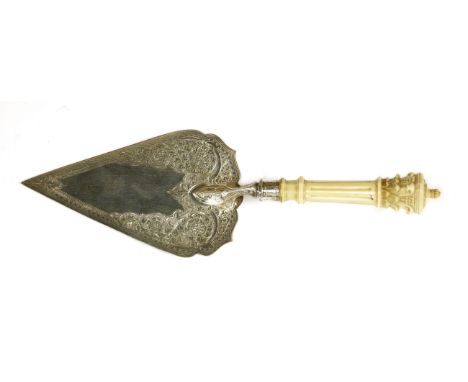 A Victorian silver and ivory ceremonial trowel,by Levesley Brothers, Sheffield, 1877,the handle carved with a Corinthian term