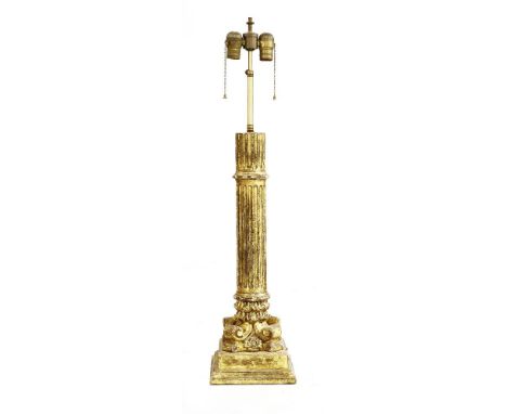 A giltwood column table lamp,the adjustable two-light mount raised on a fluted column, on a scrolled and stepped plinth,86cm 