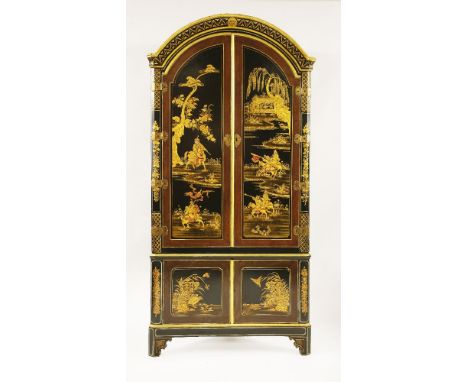 A large japanned corner cupboard,18th century, the domed top over twin arching panel doors decorated with warriors on horseba