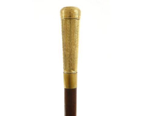 A snakewood cane,c.1880, with a brass cap that unscrews to reveal a small telescope or opera glass, the engine turned handle 