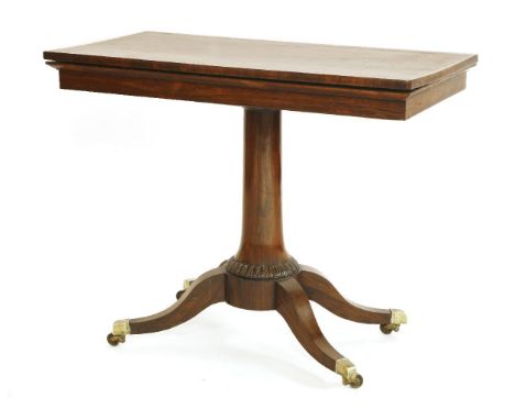 A rosewood and crossbanded fold-over card table,c.1820, on circular tapering column support, four sabre legs and brass castor