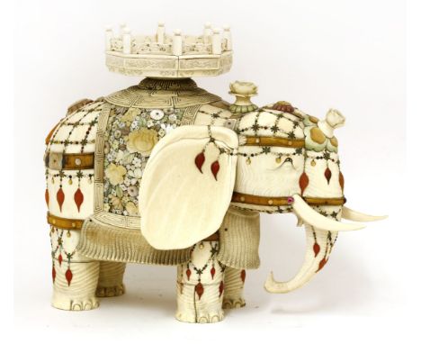 A large ivory and Shibayama decorated model of an elephant,by Masayuki, Meiji period (1868-1912), standing, with its trunk lo