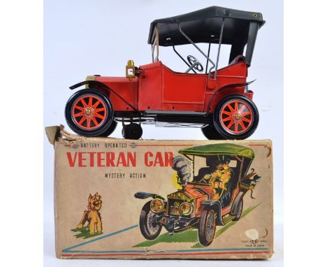 TINPLATE; An original vintage Japanese made tinplate battery operated ' Veteran Car with ' Mystery Action ' within the origin