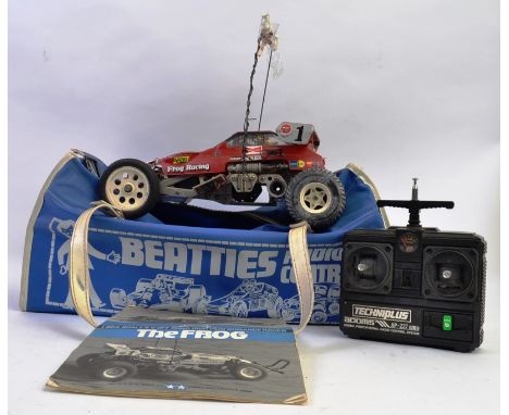 TAMIYA; An original vintage iconic Tamiya ' Frog ' radio controlled car. Comes within an original retro blue Beatties carry b