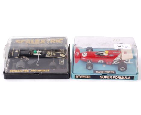 SCALEXTRIC; Two vintage Scalextric cased cars - C126 Lotus and C026 March Ford. 

NOTE; From an extensive private collection 