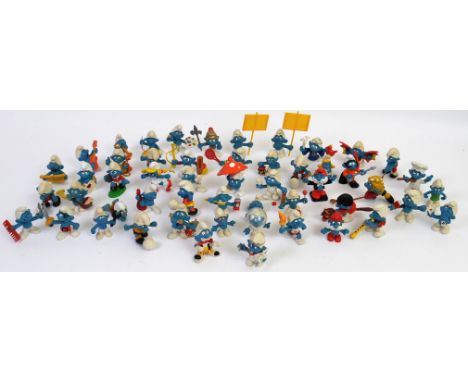 SMURFS; A collection of loose vintage Smurfs by Peyo and Schleich. Some with accessories. Approx 50 in total. 