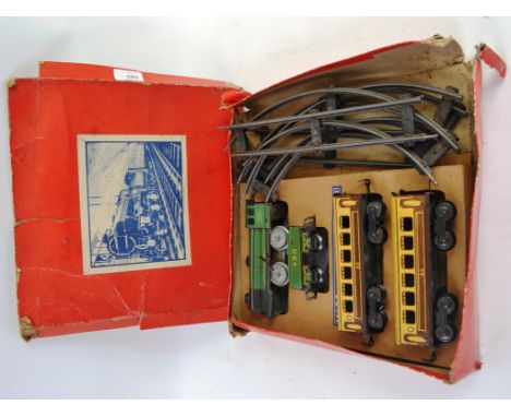 0 GAUGE; An original charming vintage 0 Gauge tinplate trainset. Unnamed, but marked ' Made In England ' within the original 